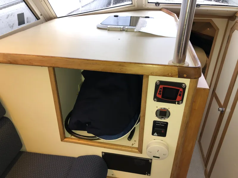 Slide: The Image of 2000 Albin 35 Tournament Express cabin interior with storage and control panel. - 21