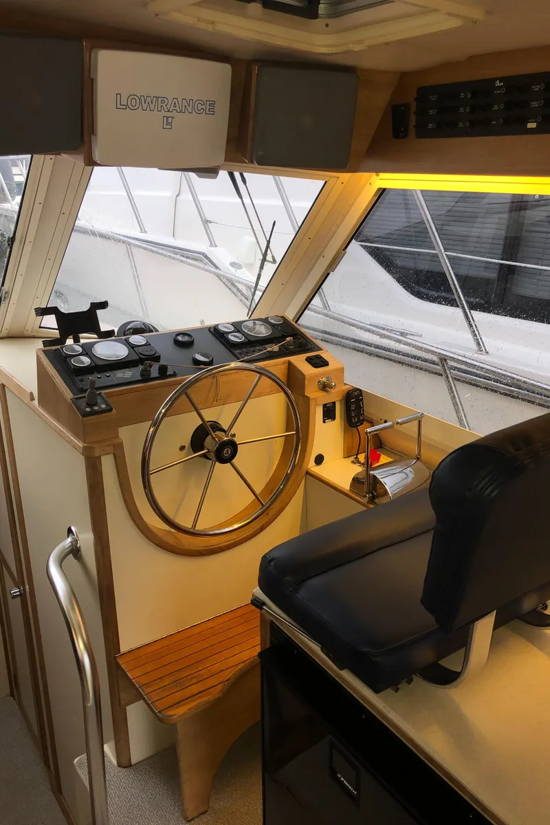 Slide: The Image of Interior helm of 2000 Albin 35 Tournament Express with steering wheel and navigation equipment. - 26