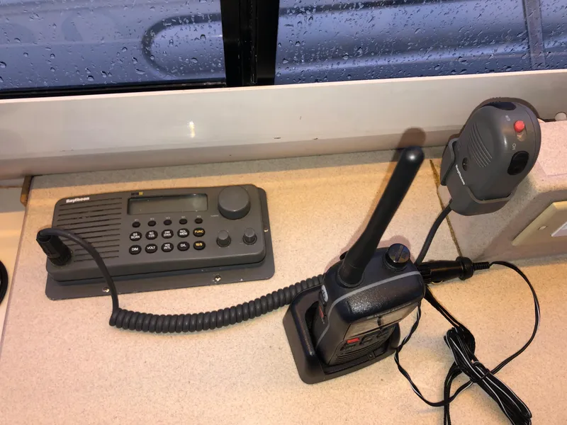 Slide: The Image of Communication equipment on a 2000 Albin 35 Tournament Express boat, featuring a radio and walkie-talkie. - 30