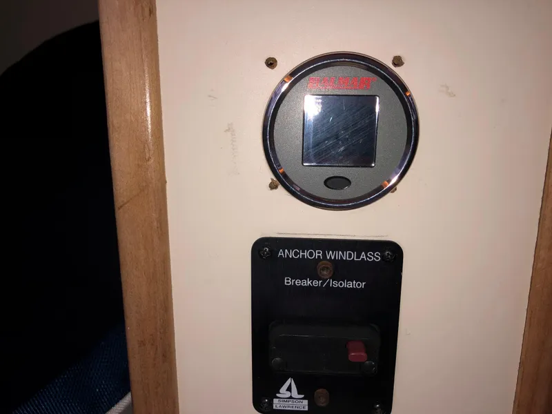 Slide: The Image of Control panel of a 2000 Albin 35 Tournament Express boat, featuring anchor windlass breaker. - 33