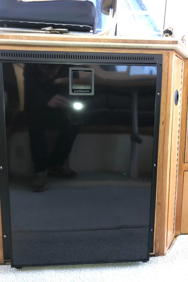 Slide: The Image of Black refrigerator inside a 2000 Albin 35 Tournament Express boat. - 34