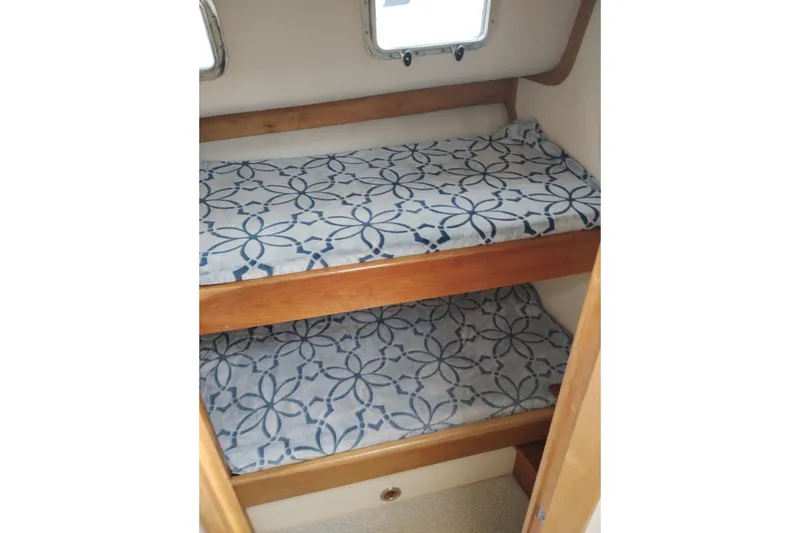 Slide: The Image of Bunk beds with patterned bedding in 2000 Albin 35 Tournament Express boat cabin. - 38