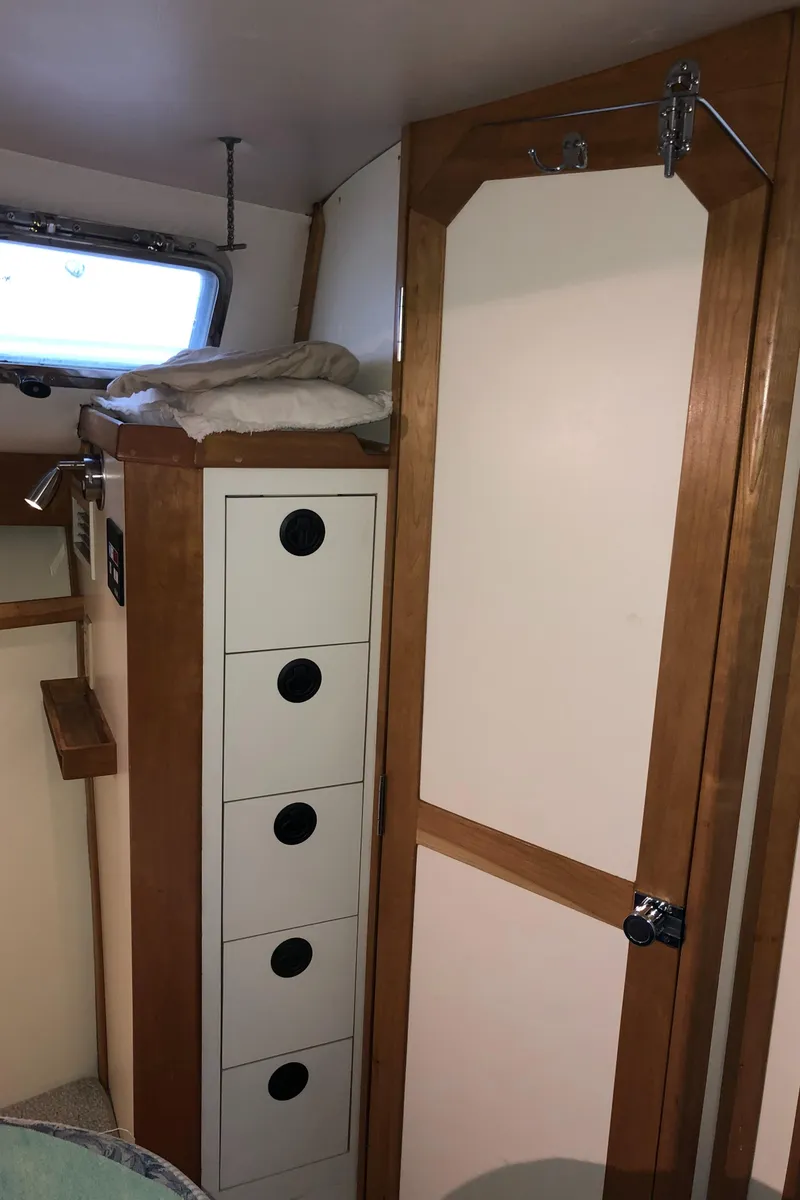 Slide: The Image of Interior of 2000 Albin 35 Tournament Express with storage drawers and wooden door. - 46