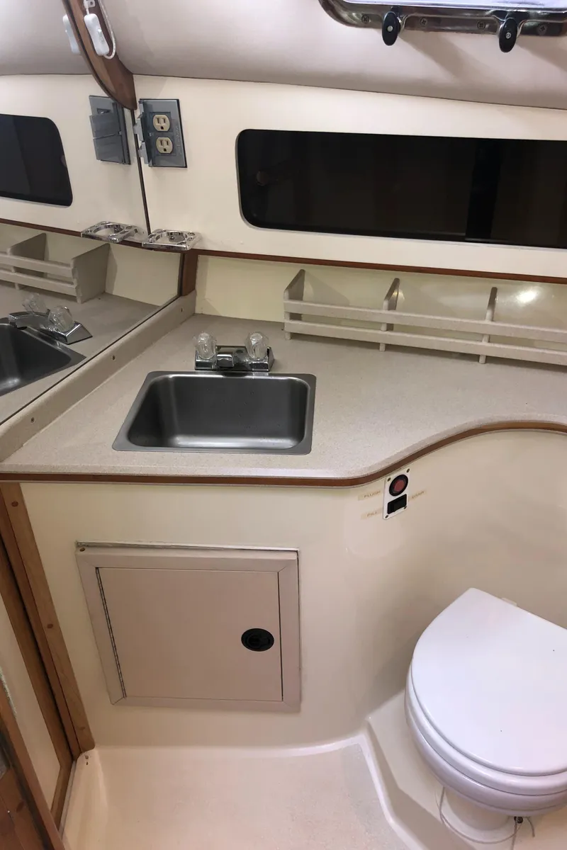 Slide: The Image of 2000 Albin 35 Tournament Express boat bathroom with sink and toilet. - 47