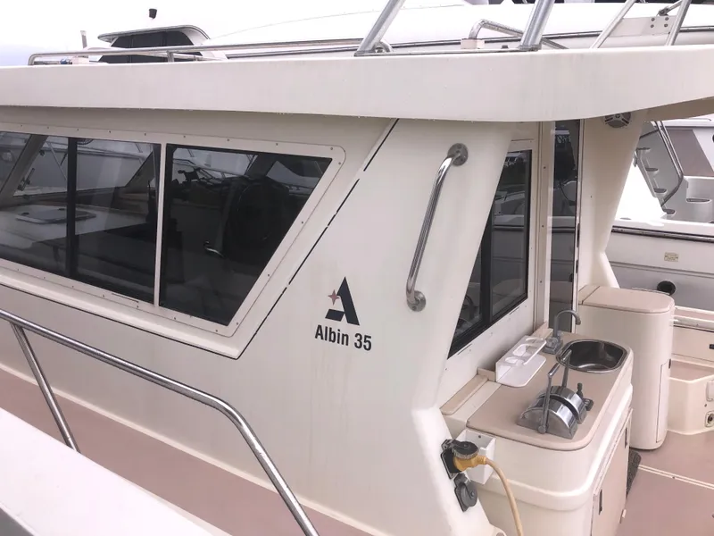 Slide: The Image of 2000 Albin 35 Tournament Express boat with sleek cabin design and outdoor sink. - 5