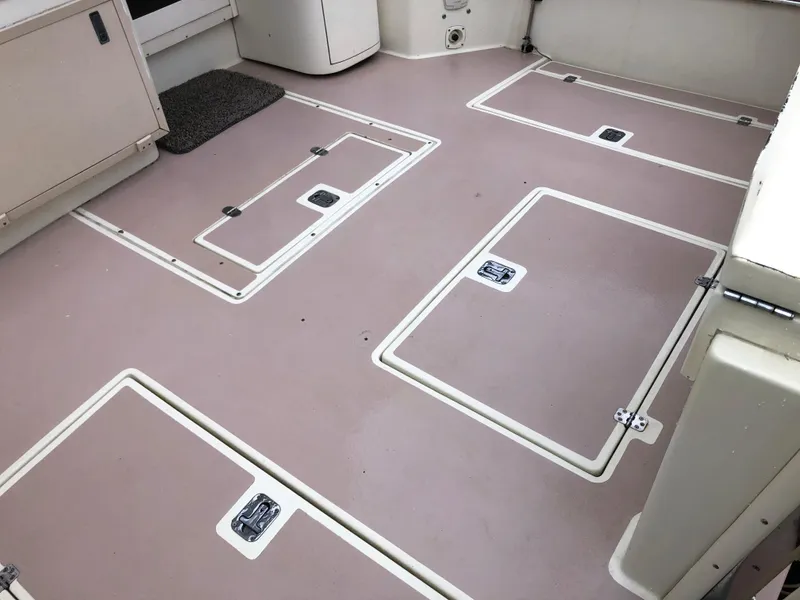 Slide: The Image of 2000 Albin 35 Tournament Express boat deck with multiple storage hatches. - 7