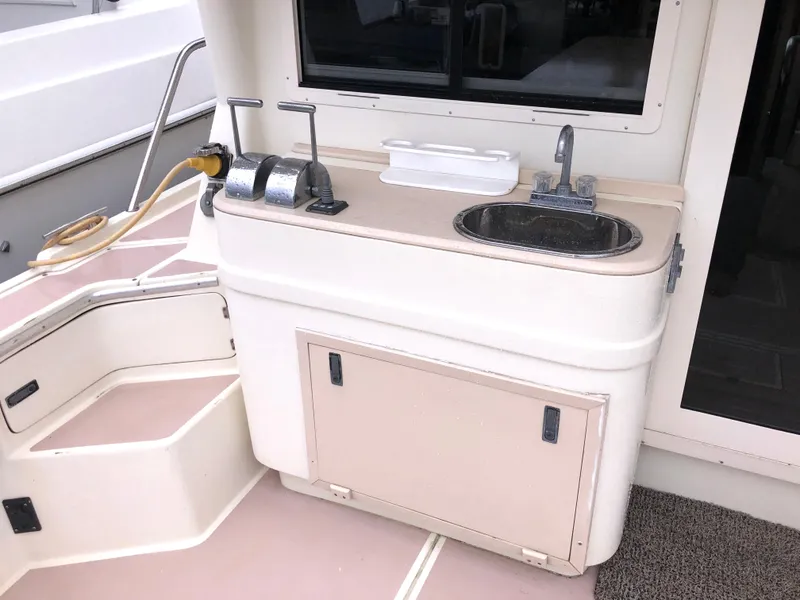 Slide: The Image of Albin 35 Tournament Express 2000 boat galley with sink and storage. - 9