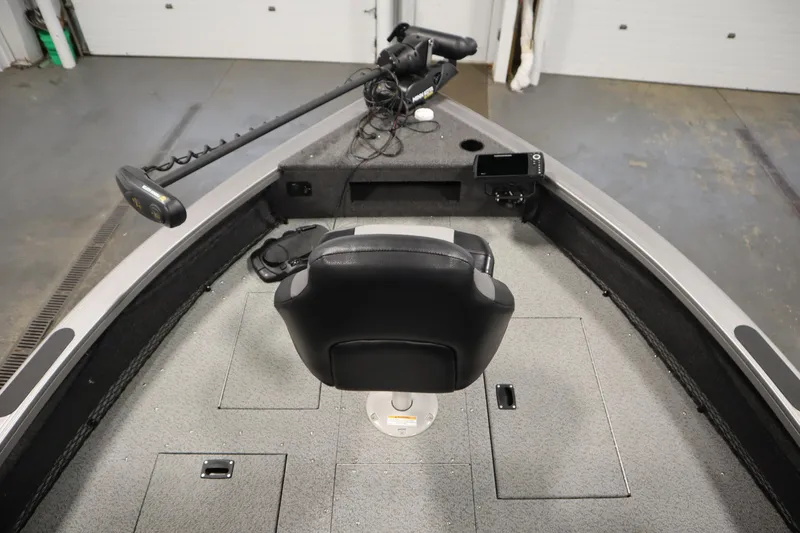 Slide: The Image of 2024 Crestliner 1950 Fish Hawk WT boat interior with seat and trolling motor. - 11