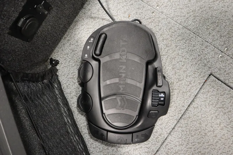 Slide: The Image of Minn Kota foot pedal on 2024 Crestliner 1950 Fish Hawk WT boat carpet. - 15