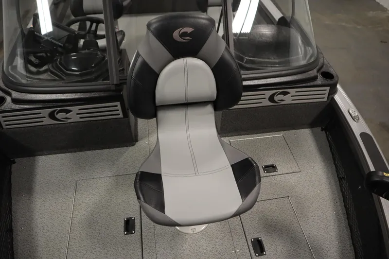 Slide: The Image of 2024 Crestliner 1950 Fish Hawk WT boat interior with sleek seating and windshield. - 19