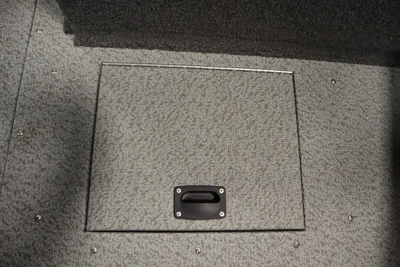 Slide: The Image of 2024 Crestliner 1950 Fish Hawk WT storage compartment with textured gray finish. - 22