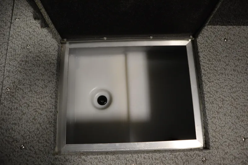 Slide: The Image of 2024 Crestliner 1950 Fish Hawk WT livewell compartment, open and empty. - 23