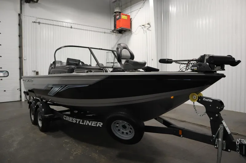 Slide: The Image of 2024 Crestliner 1950 Fish Hawk WT boat on trailer in indoor storage. - 3