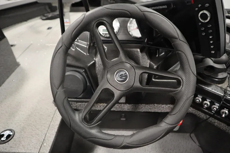 Slide: The Image of Steering wheel of 2024 Crestliner 1950 Fish Hawk WT boat with control panel. - 33