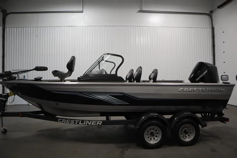 Slide: The Image of 2024 Crestliner 1950 Fish Hawk WT boat in a showroom, side view. - 8