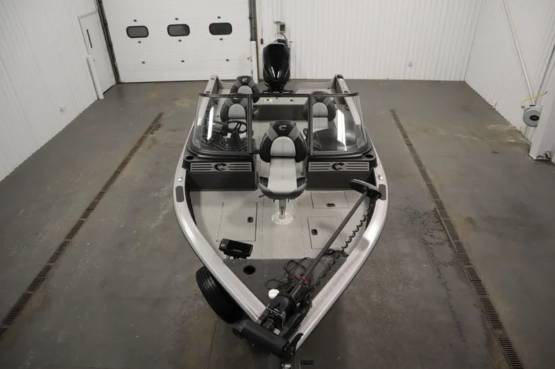 Slide: The Image of 2024 Crestliner 1950 Fish Hawk WT boat in a spacious indoor setting. - 9