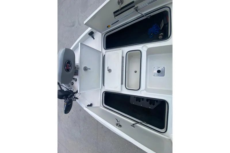 Slide: The Image of 2013 Ranger Z518 Intracoastal boat interior with storage compartments and seating. - 14