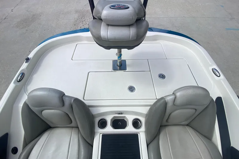 Slide: The Image of 2013 Ranger Z518 Intracoastal boat interior with seating and storage compartments. - 21