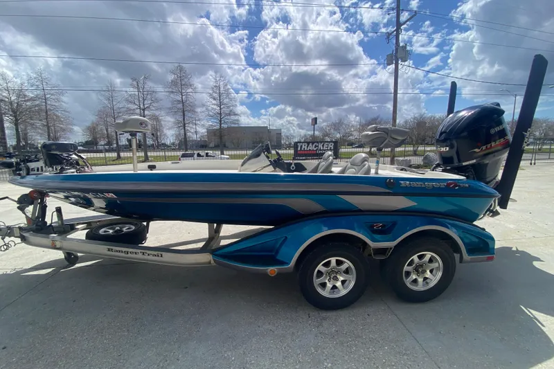 Slide: The Image of 2013 Ranger Z518 Intracoastal boat on trailer under cloudy sky. - 7