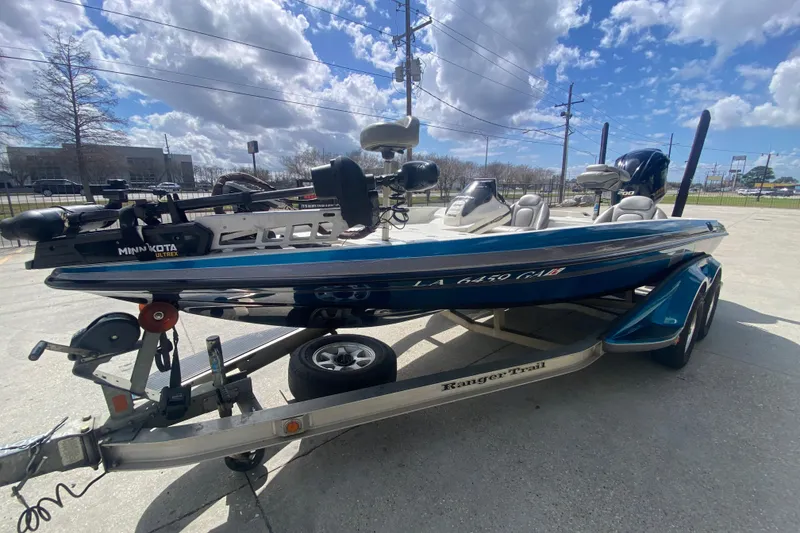 Slide: The Image of 2013 Ranger Z518 Intracoastal boat on trailer under a partly cloudy sky. - 8