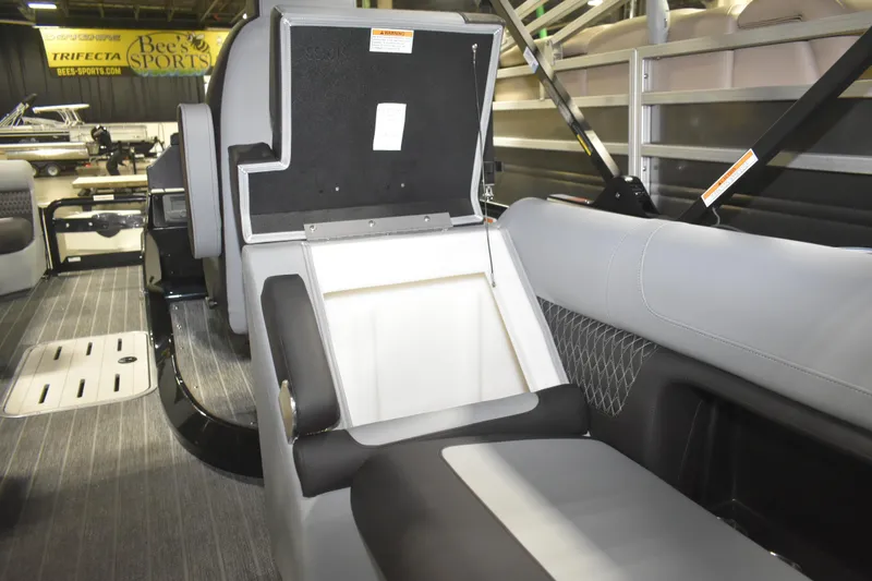 Slide: The Image of 2026 Premier 230 Solaris RF - PTX CL boat interior with open storage compartment. - 16