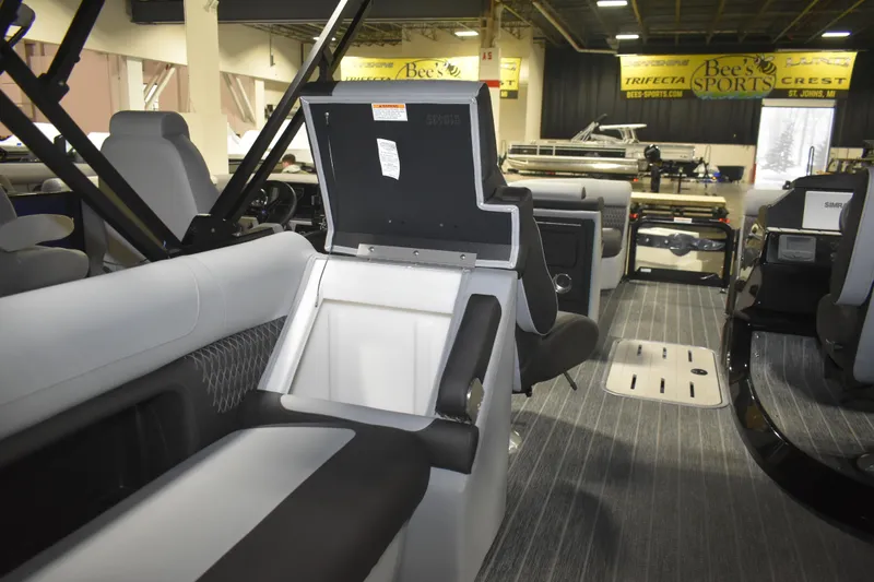 Slide: The Image of 2026 Premier 230 Solaris RF - PTX CL boat interior with open storage compartment. - 17