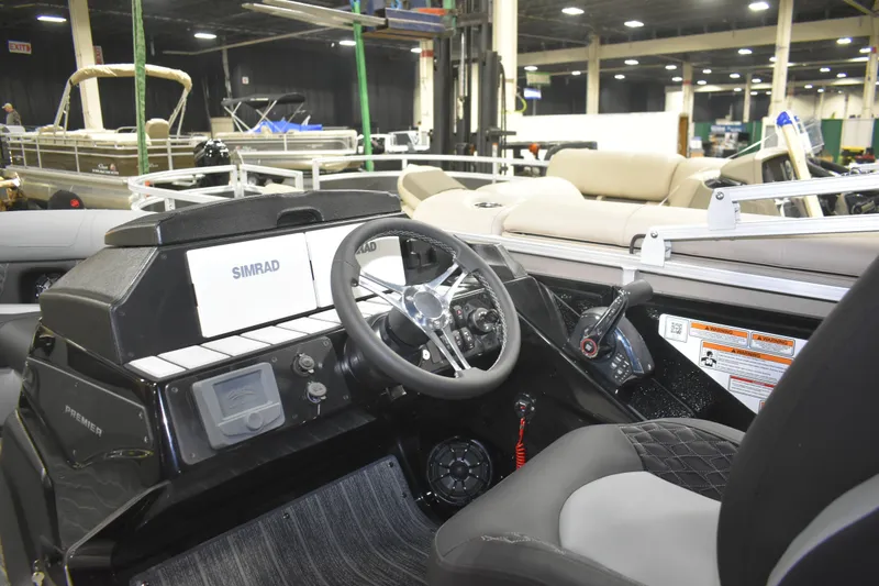 Slide: The Image of 2026 Premier 230 SOLARIS RF - PTX CL boat interior with steering wheel and controls. - 19
