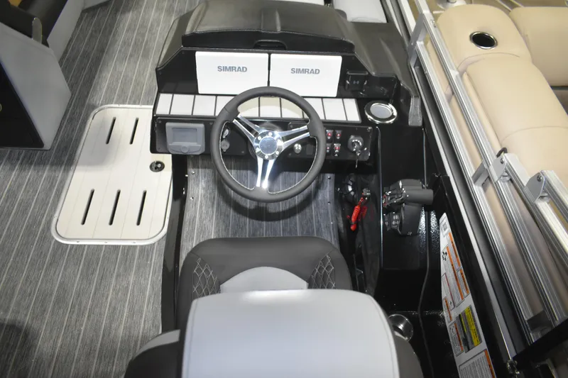 Slide: The Image of 2026 Premier 230 SOLARIS RF - PTX CL boat cockpit with steering wheel and controls. - 20