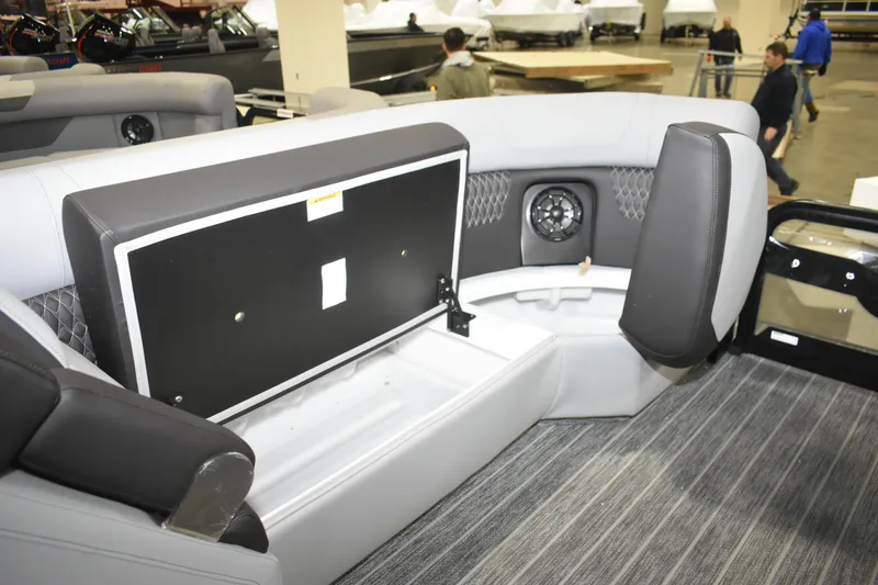 Slide: The Image of 2026 Premier 230 Solaris RF - PTX CL boat interior with open storage compartment. - 22