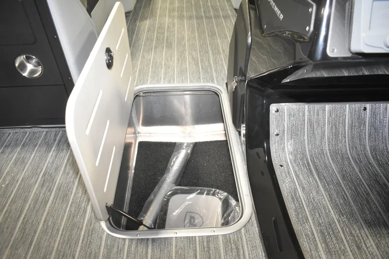 Slide: The Image of Open storage compartment in 2026 Premier 230 Solaris RF - PTX CL boat interior. - 27