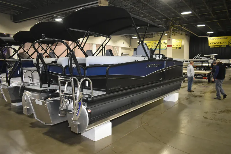 Slide: The Image of 2026 Premier 230 SOLARIS RF - PTX CL pontoon boat displayed indoors. - 4