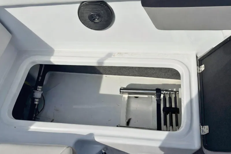 Slide: The Image of 2021 Four Winns HD1 OB boat storage compartment with ladder and speaker. - 11
