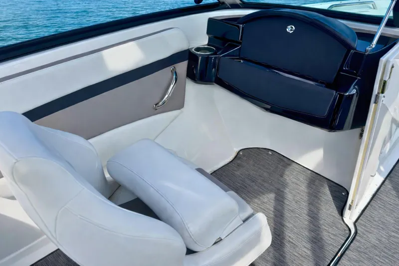 Slide: The Image of 2021 Four Winns HD1 OB boat interior with white seating and sleek design. - 13