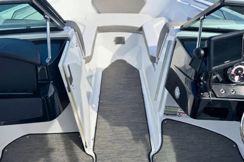 Slide: The Image of 2021 Four Winns HD1 OB boat interior with open windshield and dashboard view. - 20