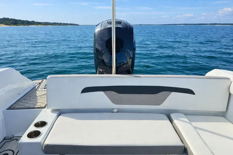 Slide: The Image of 2021 Four Winns HD1 OB boat with outboard motor on calm blue water. - 6