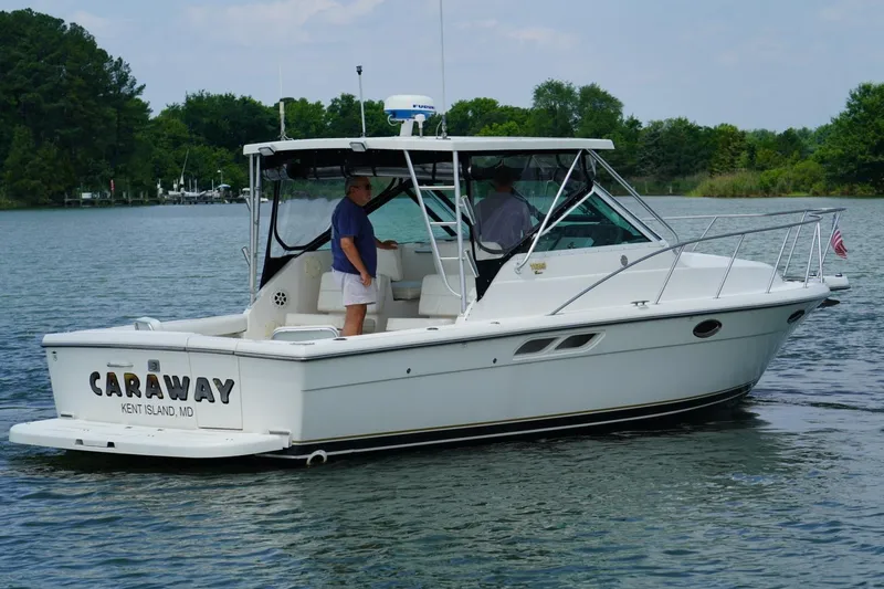 Slide: The Image of 2004 Tiara Yachts 2900 Open Classic boat on water, featuring "Caraway" from Kent Island, MD. - 11