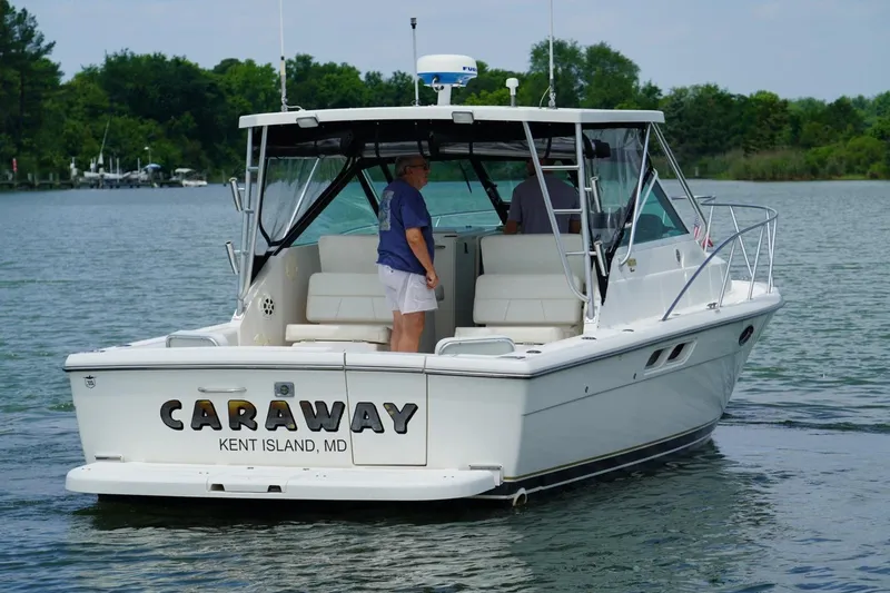 Slide: The Image of 2004 Tiara Yachts 2900 Open Classic boat on water, named "Caraway," Kent Island, MD. - 12