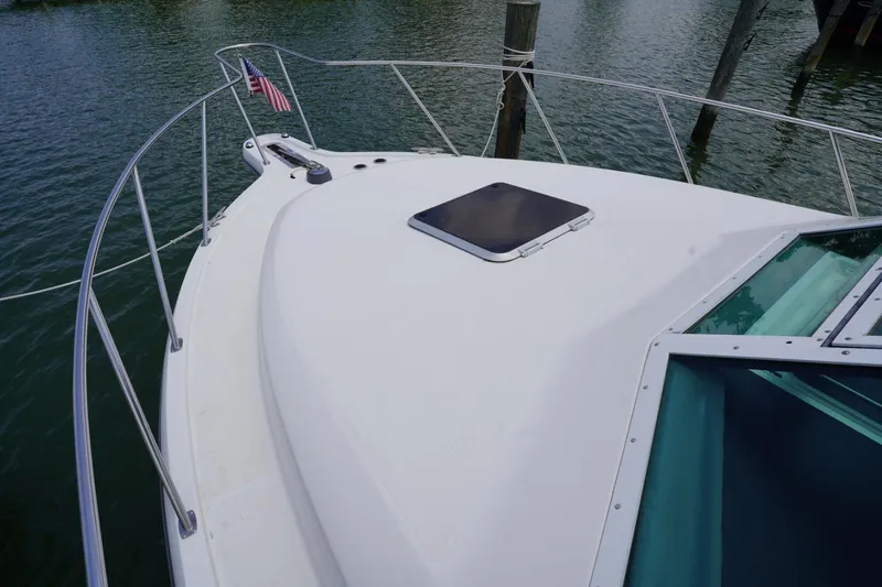 Slide: The Image of 2004 Tiara Yachts 2900 Open Classic boat deck with railing and hatch. - 16