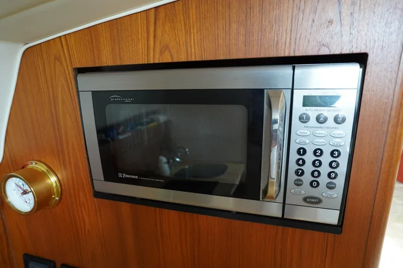 Slide: The Image of Microwave in 2004 Tiara Yachts 2900 Open Classic, wooden interior detail. - 38