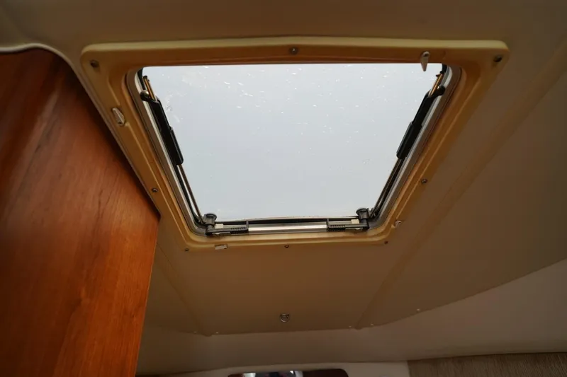 Slide: The Image of 2004 Tiara Yachts 2900 Open Classic cabin skylight view. - 44