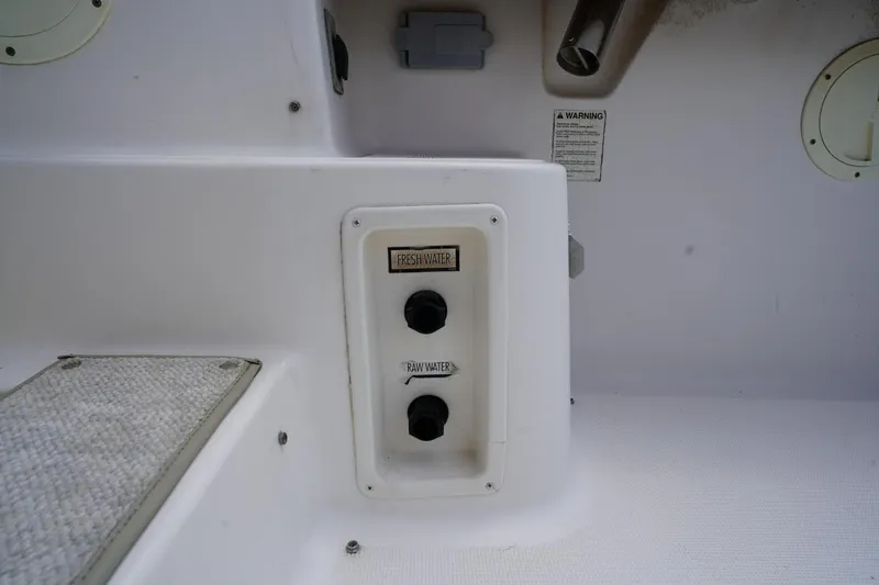 Slide: The Image of 2004 Tiara Yachts 2900 Open Classic water control panel with fresh and raw water options. - 45