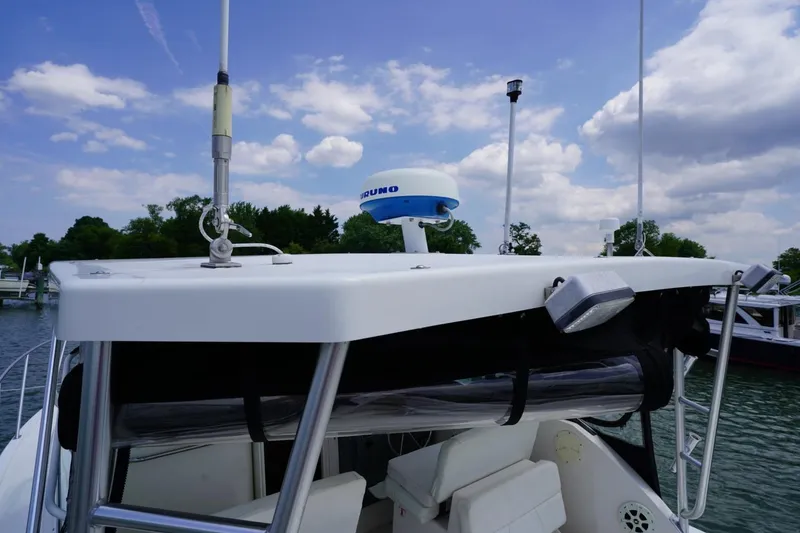 Slide: The Image of 2004 Tiara Yachts 2900 Open Classic boat with radar and antennas on deck. - 47