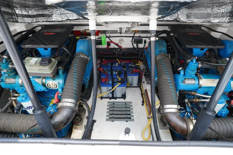 Slide: The Image of Engine compartment of 2004 Tiara Yachts 2900 Open Classic, showcasing dual engines and components. - 49