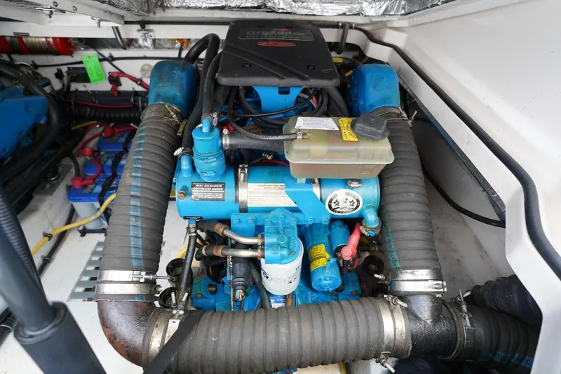 Slide: The Image of Engine compartment of 2004 Tiara Yachts 2900 Open Classic, showcasing detailed mechanical components. - 51
