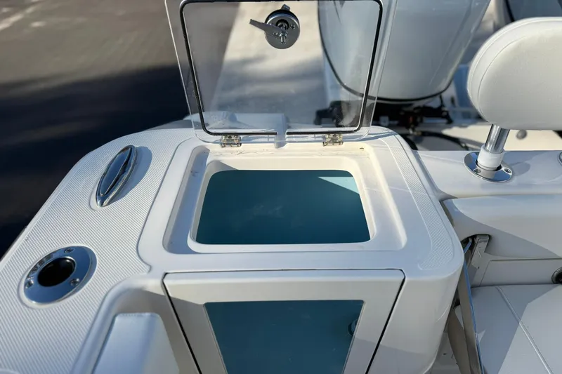 Slide: The Image of 2026 Bulls Bay 255 Center Console boat with open storage compartment and seating. - 10