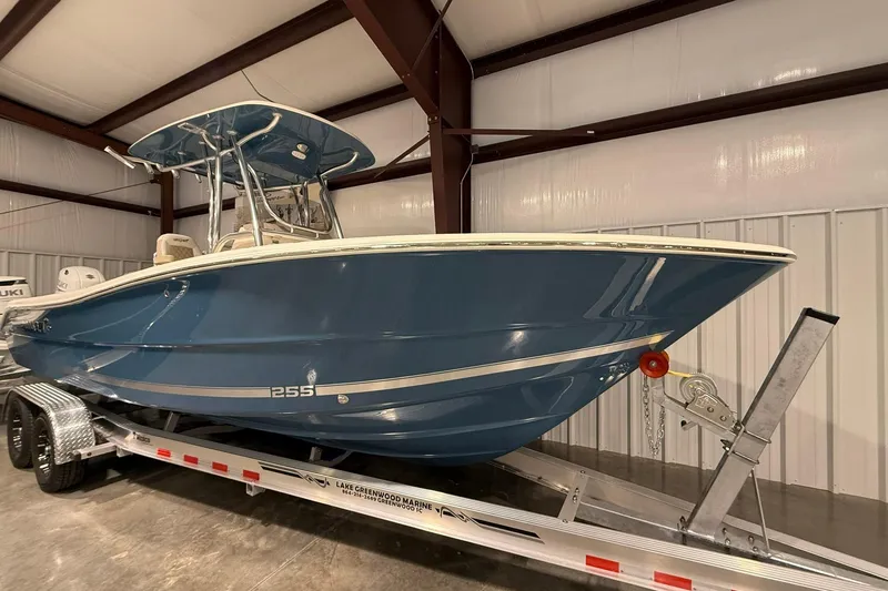 Slide: The Image of 2026 Bulls Bay 255 Center Console boat on trailer in storage facility. - 14