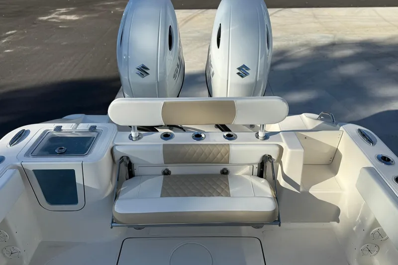 Slide: The Image of 2026 Bulls Bay 255 Center Console boat with dual Suzuki engines and seating area. - 5