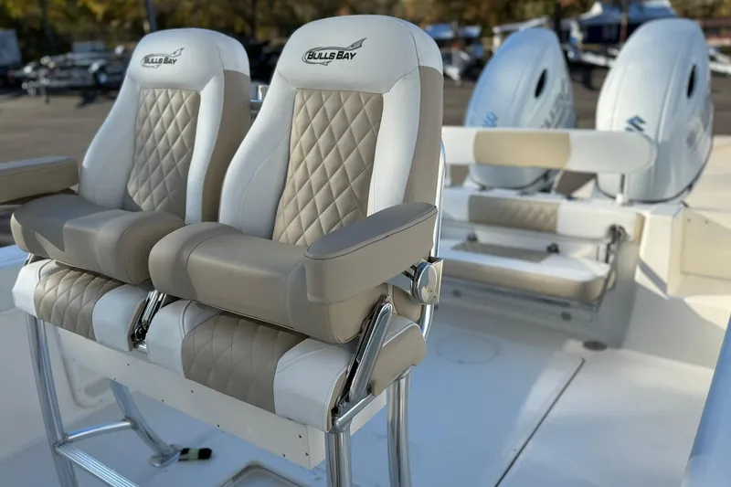 Slide: The Image of 2026 Bulls Bay 255 Center Console boat with luxurious seating and dual engines. - 7