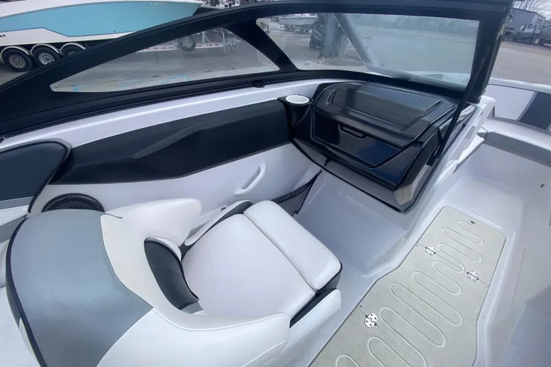 Slide: The Image of 2018 Scarab 215 G boat interior with white seating and modern dashboard design. - 21