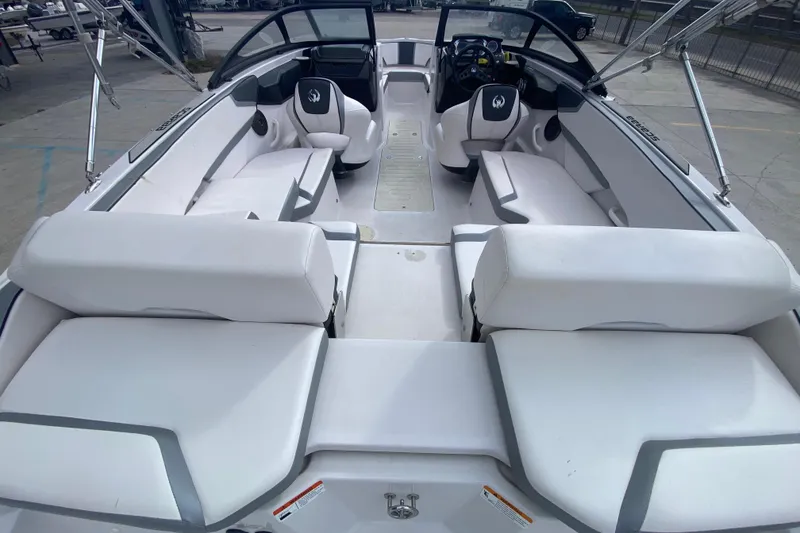 Slide: The Image of 2018 Scarab 215 G boat interior with white seating and modern design. - 8